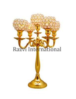 CRYSTAL CANDELABRA :ROSE GOLD 
Item Code: A 1429-2
Finish: Gold
Material: Aluminium
Keywords: MORADABAD CANDELABRA